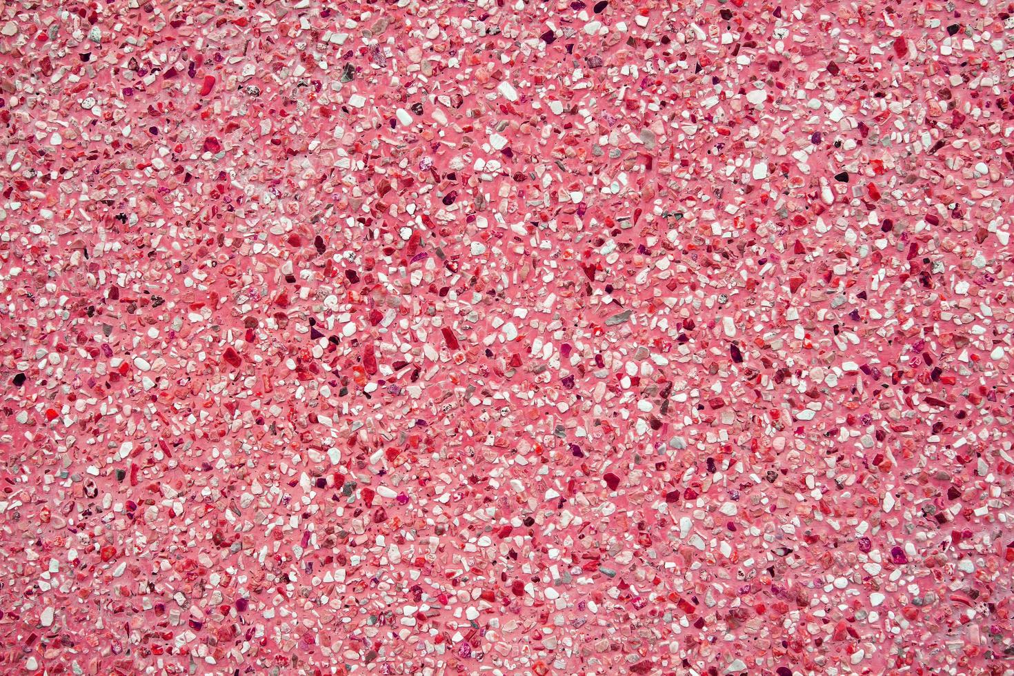 Red or pink gravel pattern or concrete wall for background. Surface of Material and Mineral art and abstract wallpaper concept photo