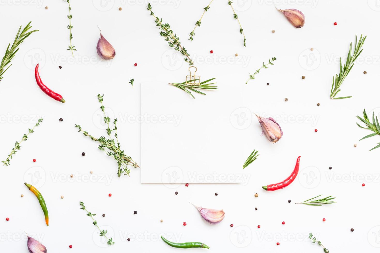 Blank notepad pages with greens herbs and spices photo