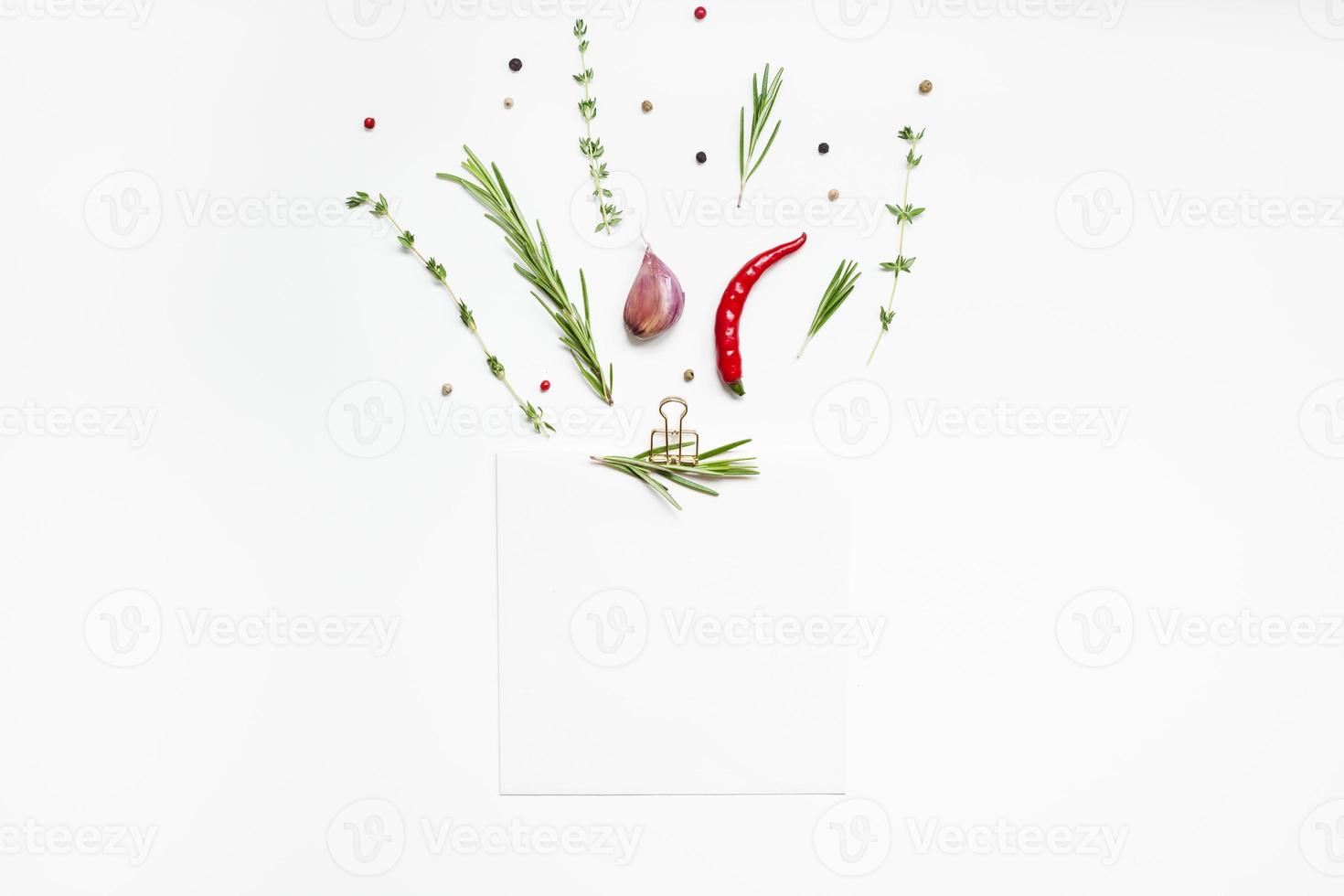 Blank notepad pages with greens herbs and spices photo