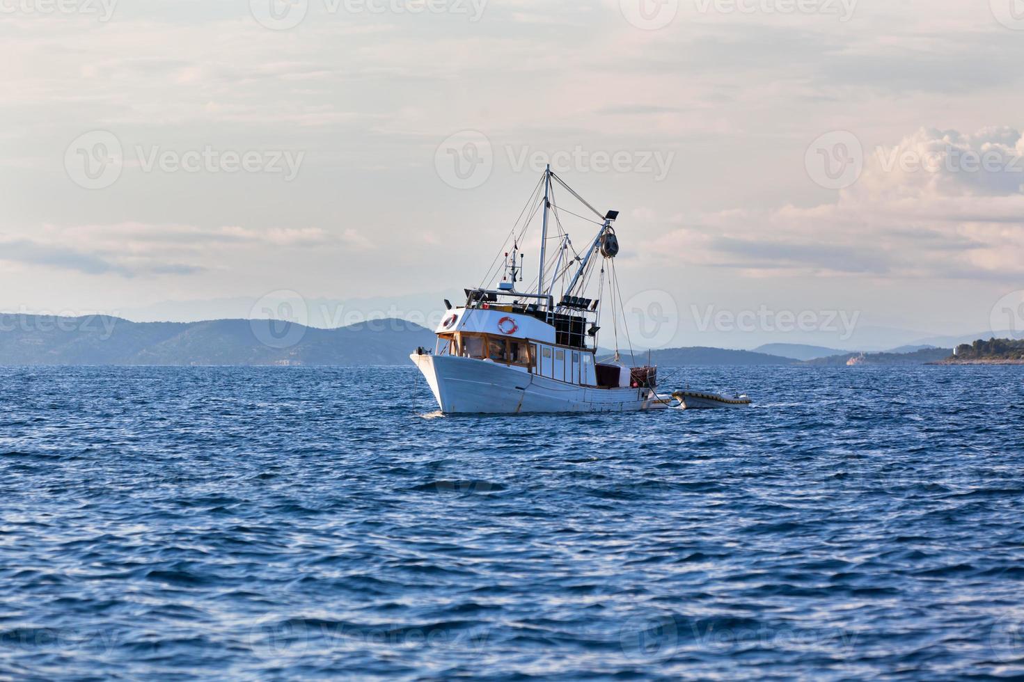 Old fishing boat in Adriatic sea photo