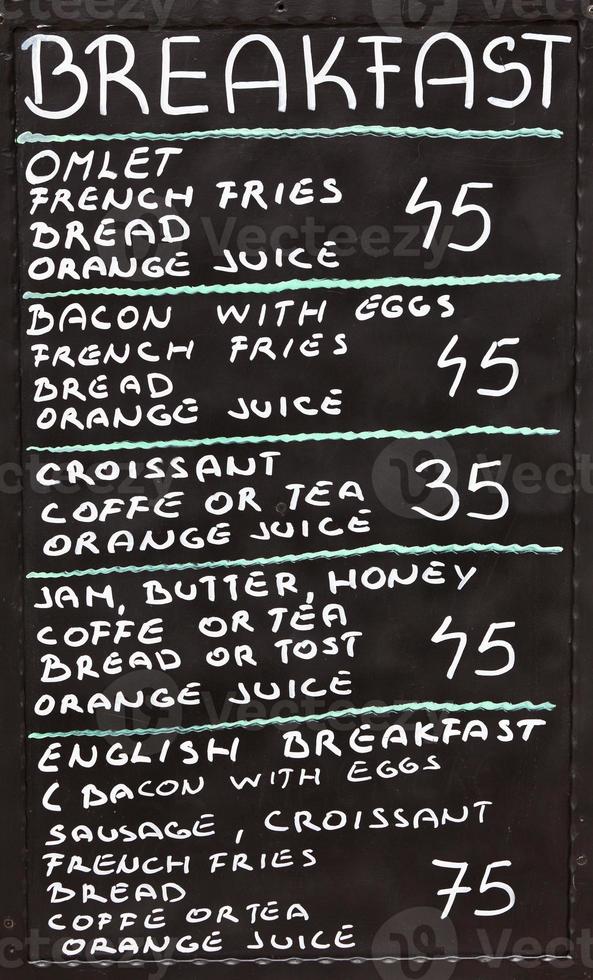 Street cafe breakfast menu written in chalk on a blackboard photo