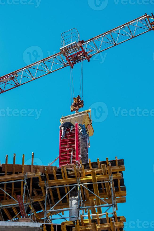 Construction formwork, reinforcement for the construction of buildings. Workers make a concrete structure photo