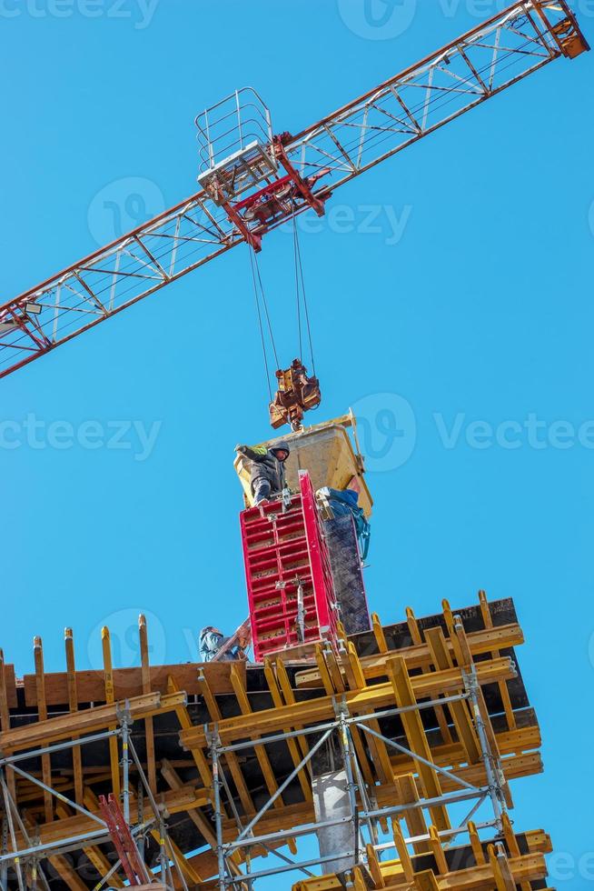 Construction formwork, reinforcement for the construction of buildings. Workers make a concrete structure. photo