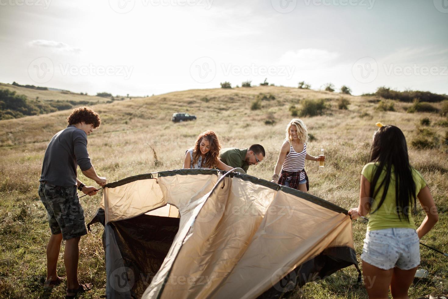 It Takes Teamwork To Set Up Their Tent photo