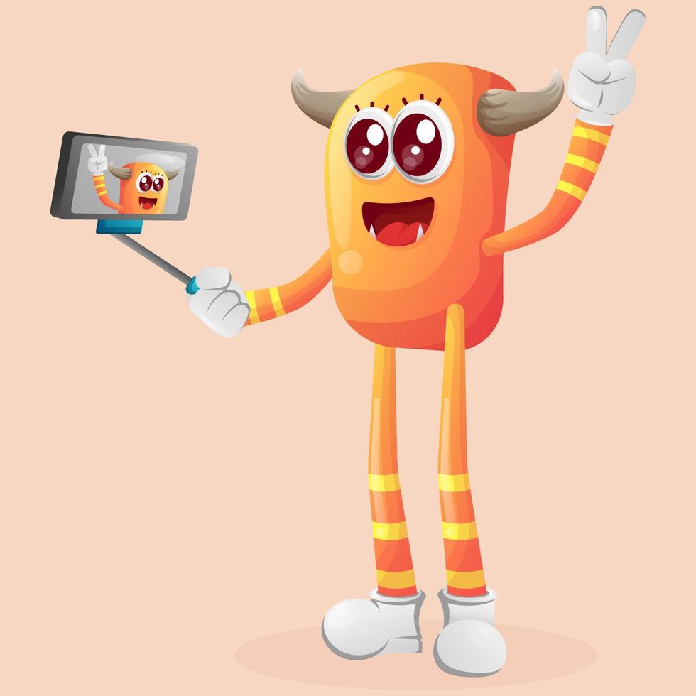 Cute orange monster takes a selfie with smartphone vector