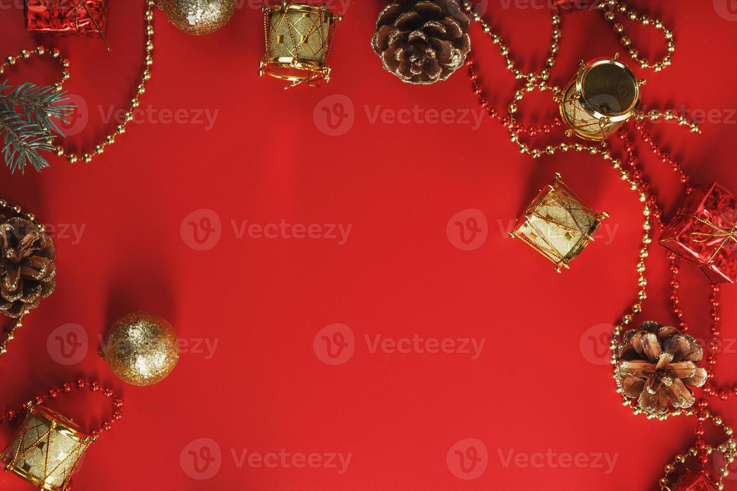 Christmas decorations with spruce branches on a red background with free space. photo