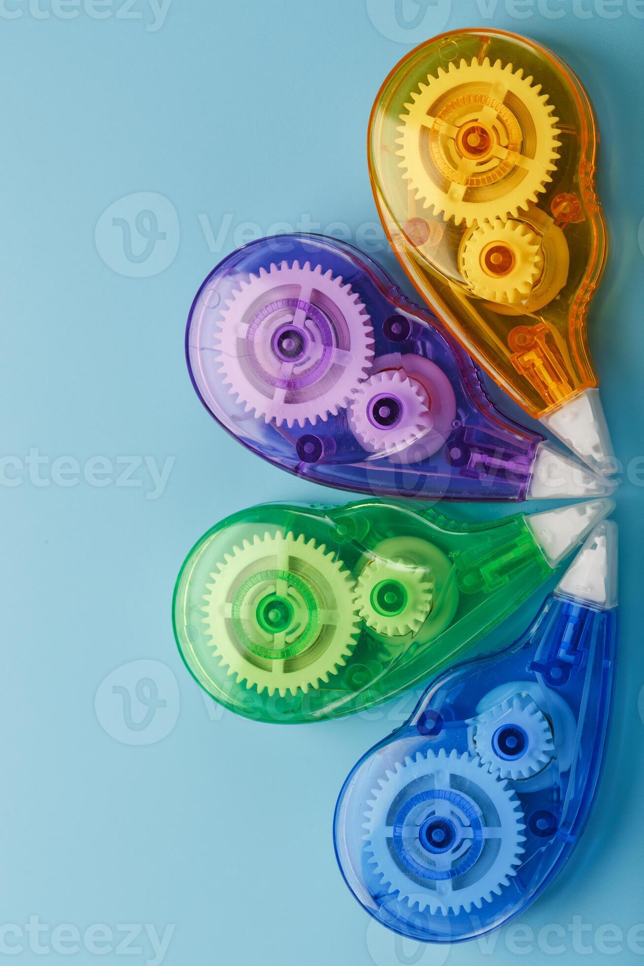 Stationery correction tapes are Multicolored on a blue background