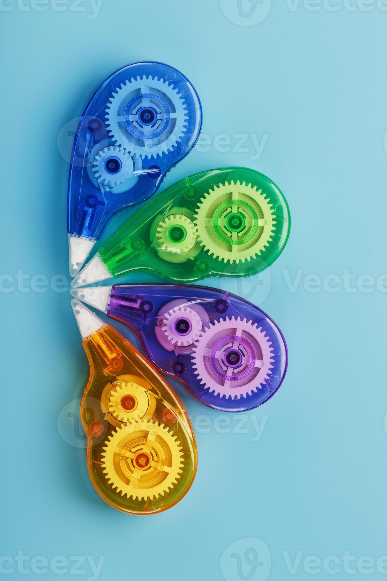 Stationery correction tapes are Multicolored on a blue background