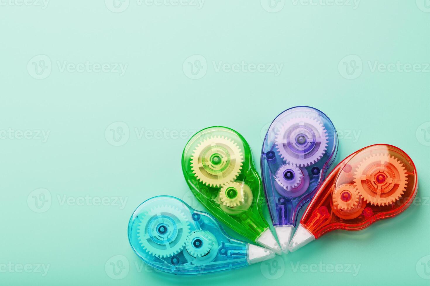 Multicolored Stationery correction tapes on a blue background