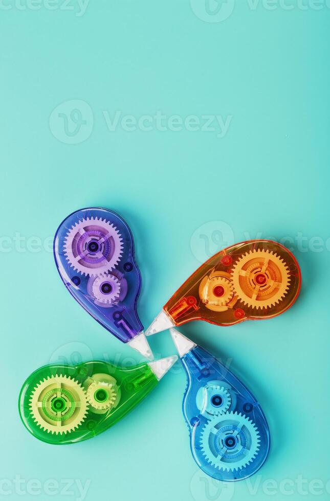 Stationery correction tapes are Multicolored on a blue background