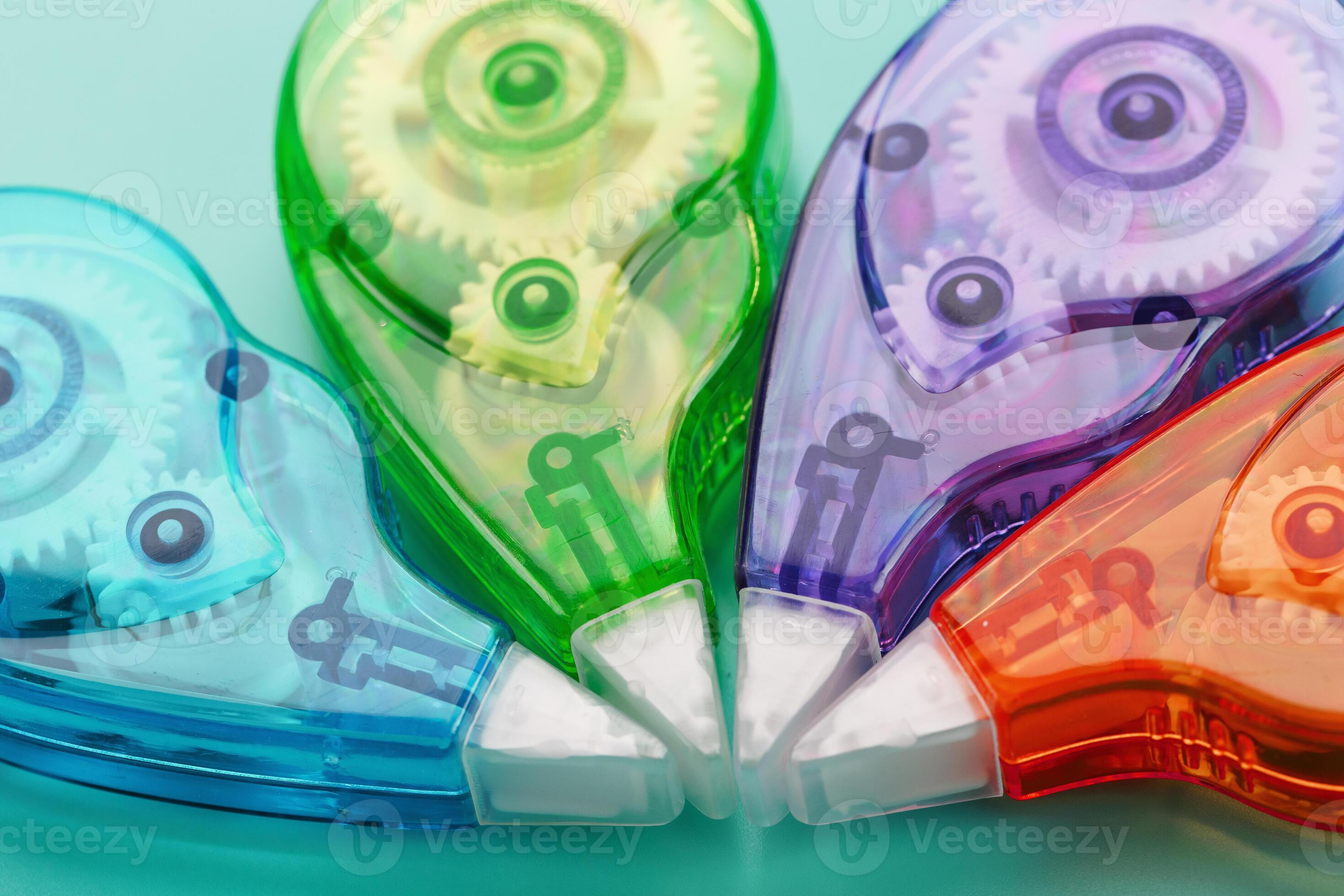 Stationery correction tapes are Multicolored on a blue background