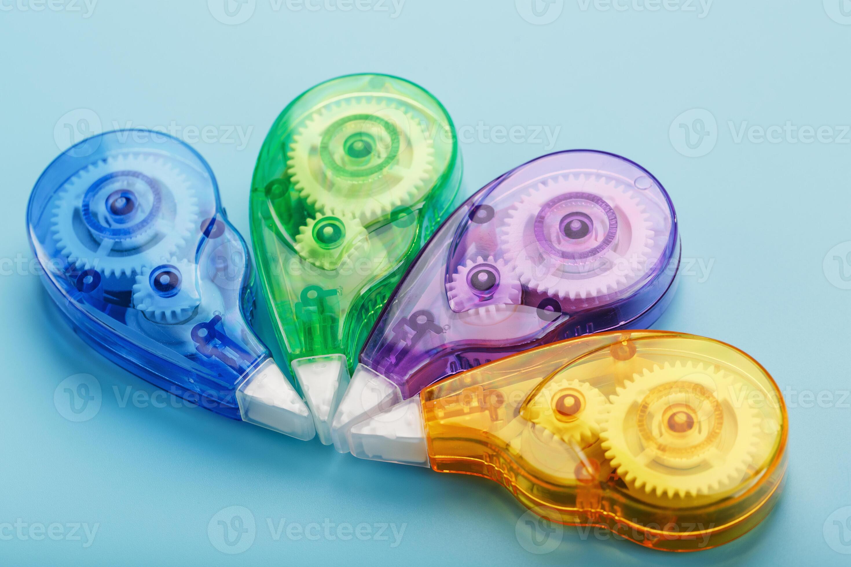 Stationery correction tapes are Multicolored on a blue background