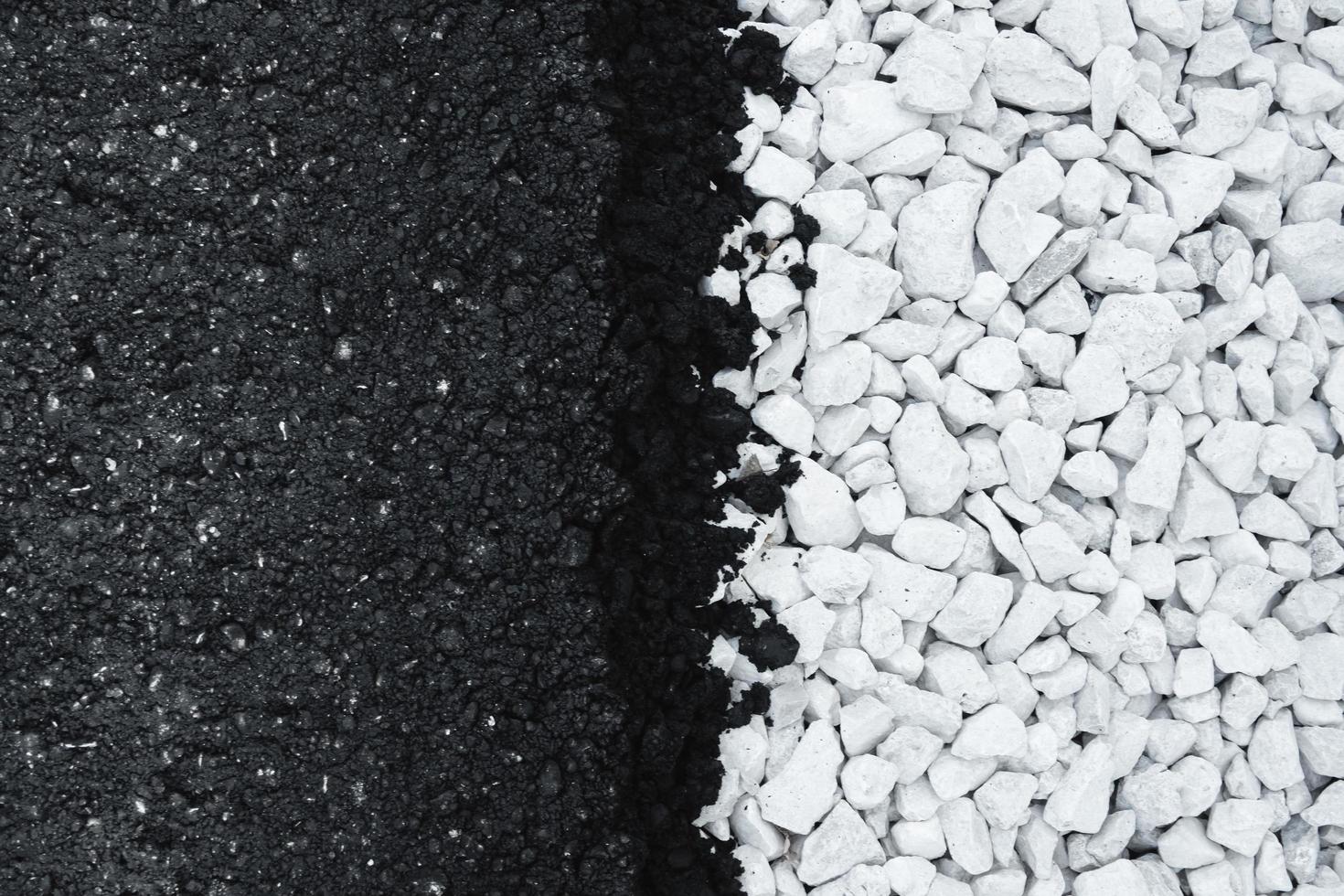 Black new asphalt and white gravel flat background. photo