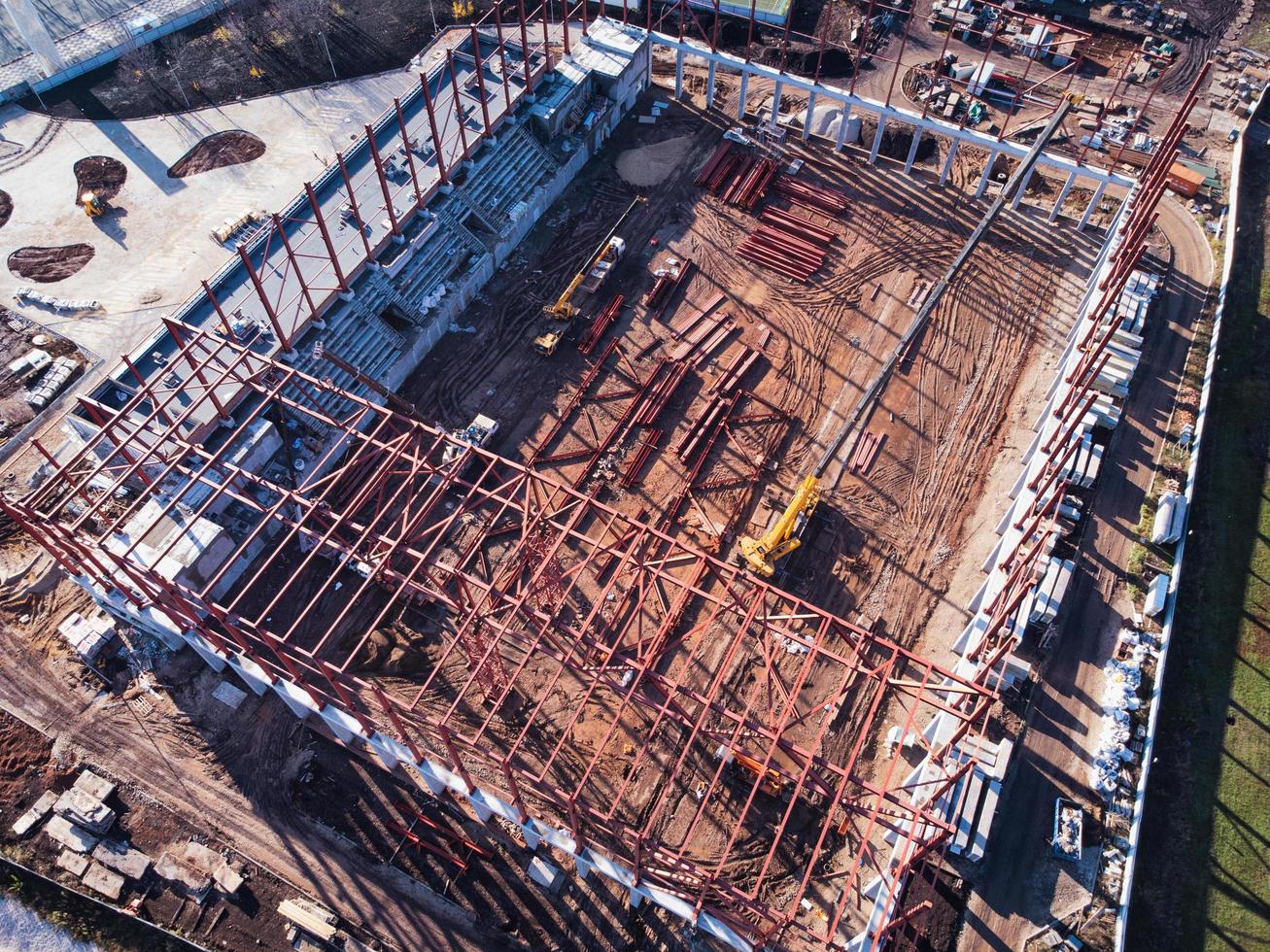 Unfinished metal frame of the building on a concrete base. photo