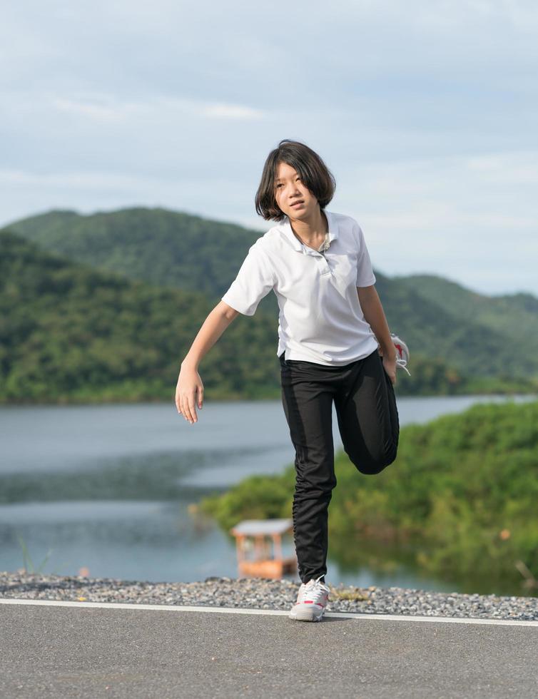 Woman short hair doing exercising outdoor photo