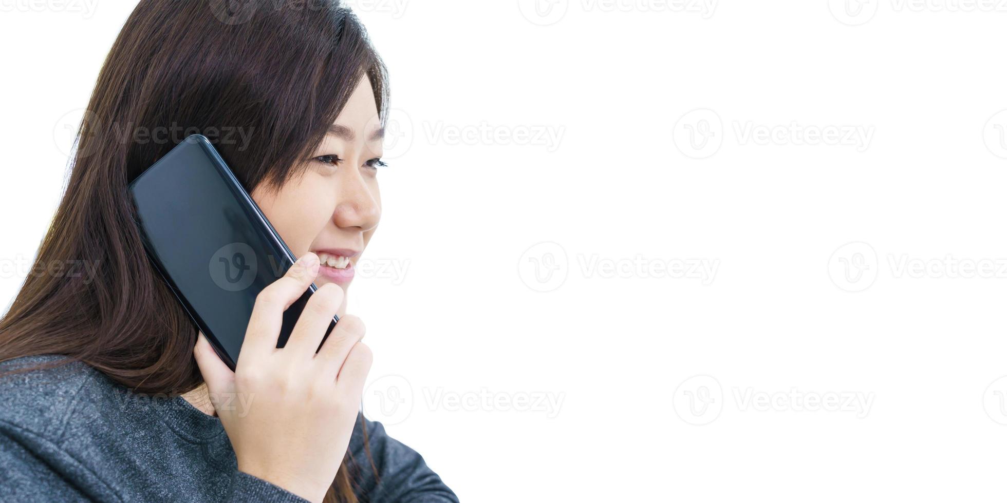 Young woman long hair talking by mobile phone photo