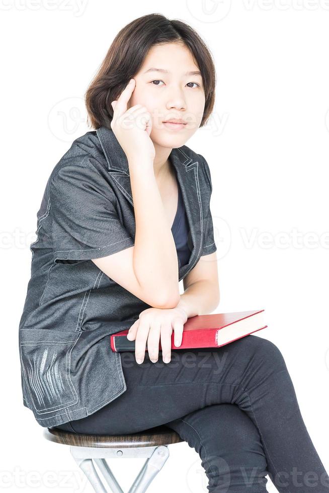 Woman reading a book sitting on chair photo