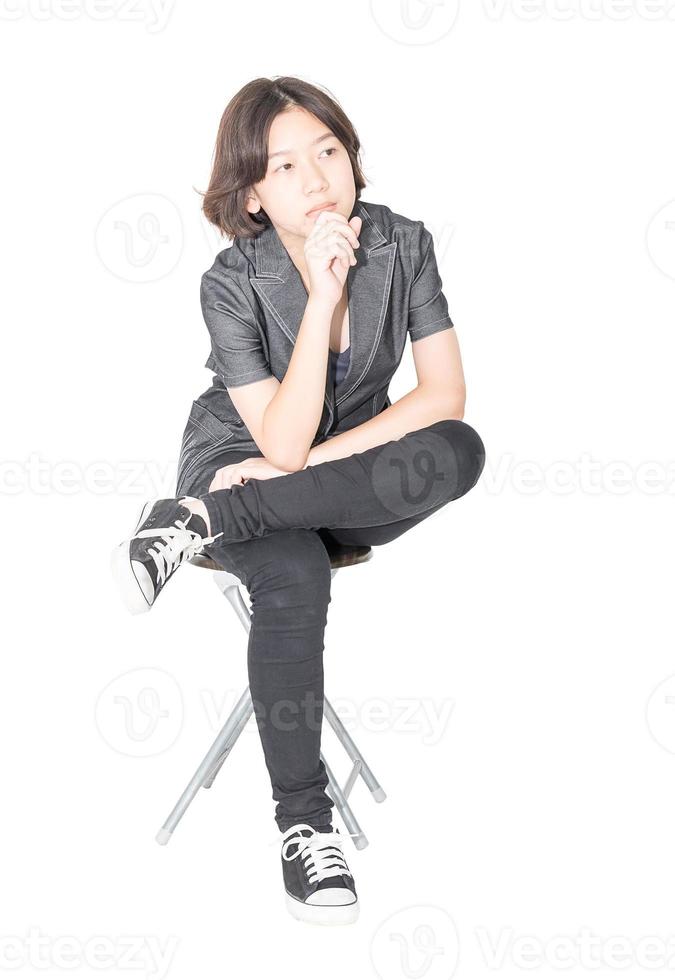 Young women sit on chair over white photo