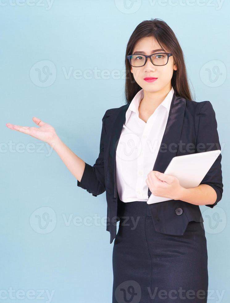 Young women standing with finger pointing up photo