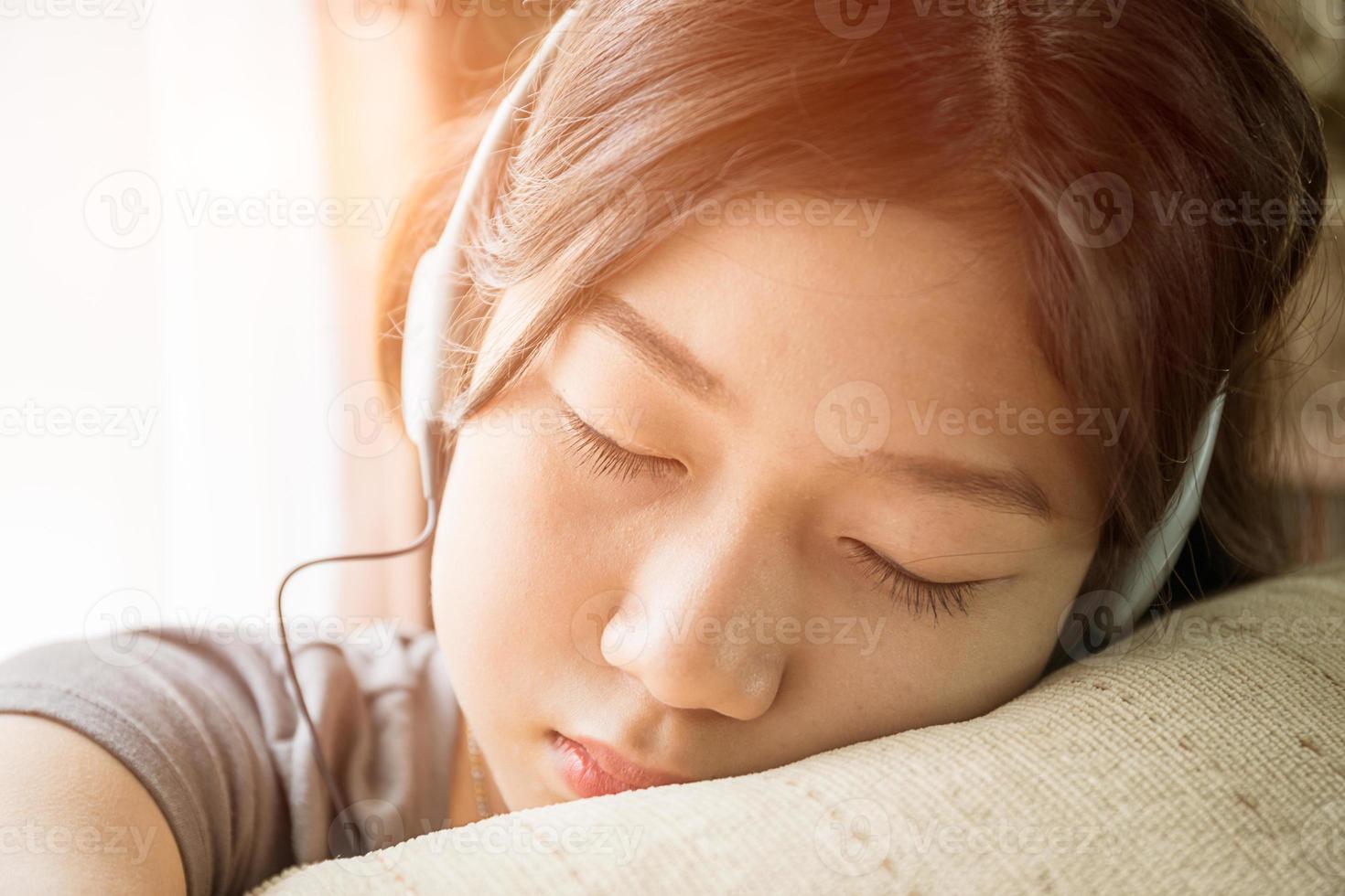 Asian woman short hair listening music photo