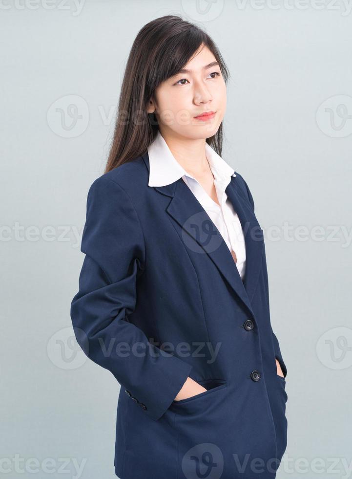 Portrait of asian businesswoman isolated on gray photo