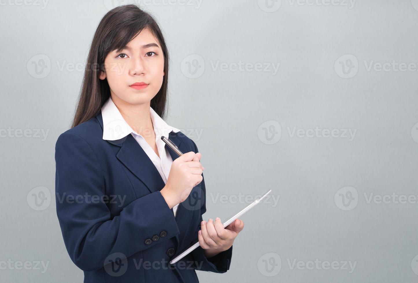 Woman in suit using computer digital tablet photo