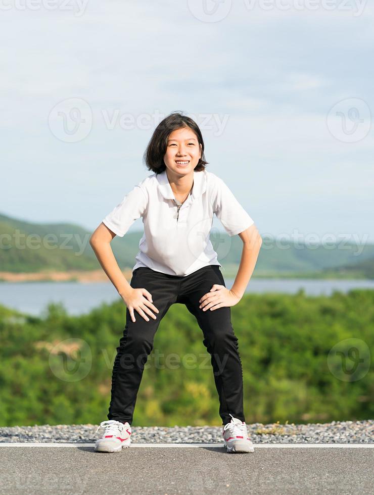 Woman doing exercising and warm up outdoor photo