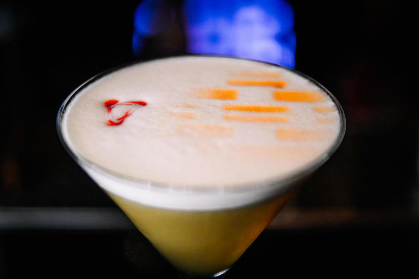 beautifully decorated cocktail in a nightclub, people drink a drink photo