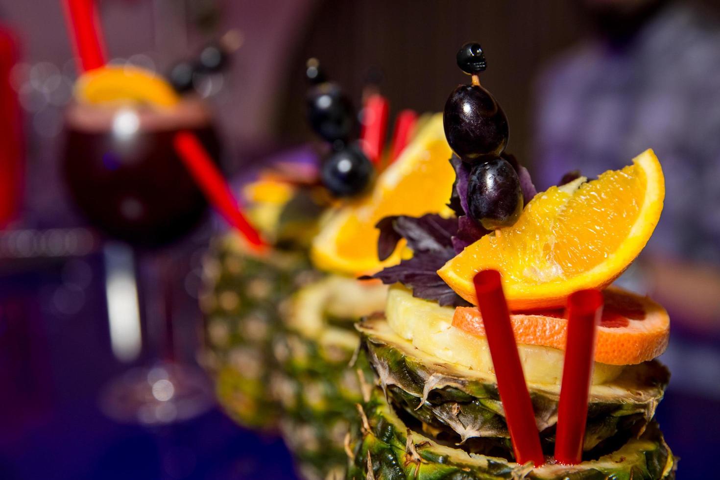 beautifully decorated cocktail in a nightclub, people drink a drink photo