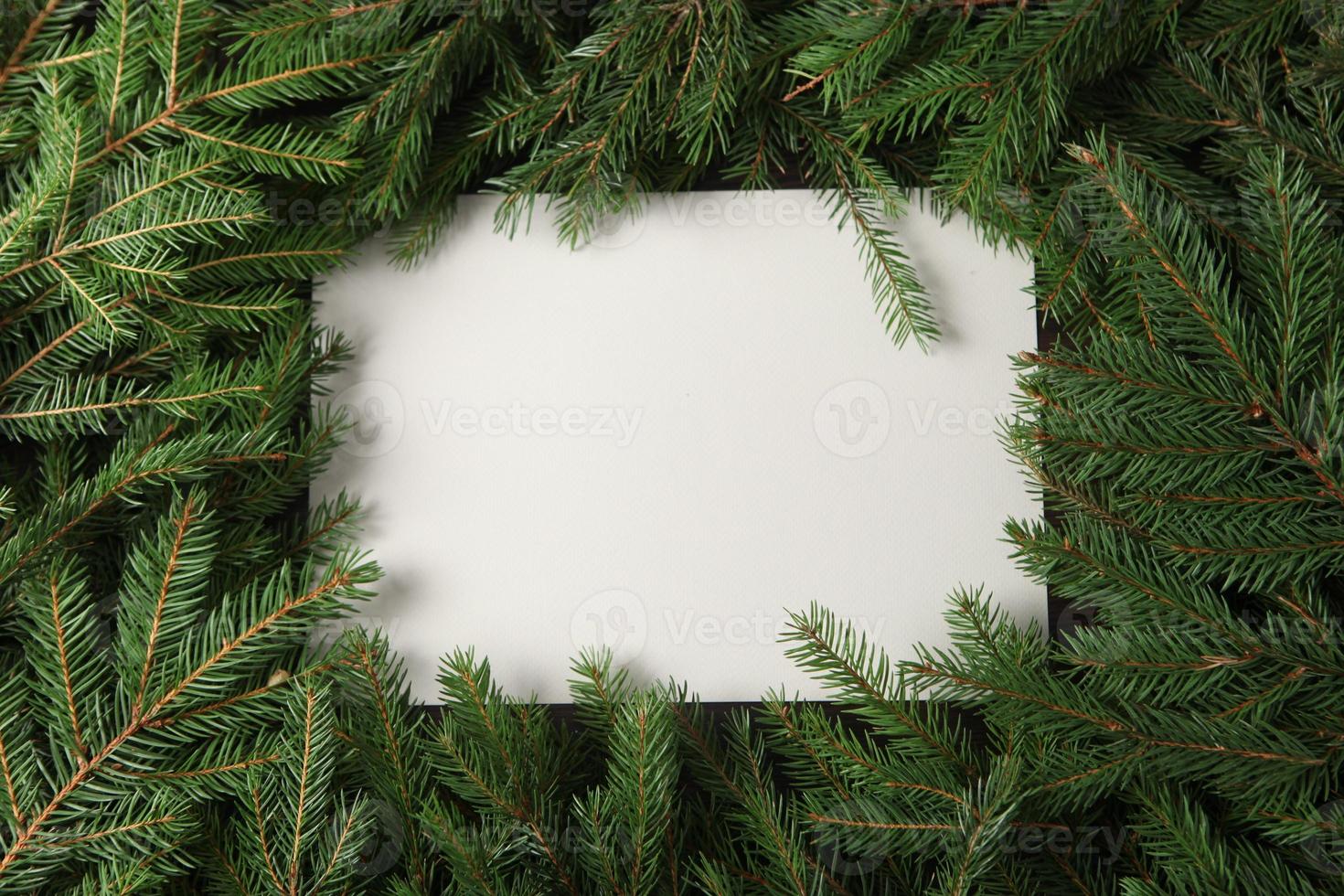 New Year's Eve background with fir branch and cones. Christmas and New Year holidays composition of pine tree branches. photo