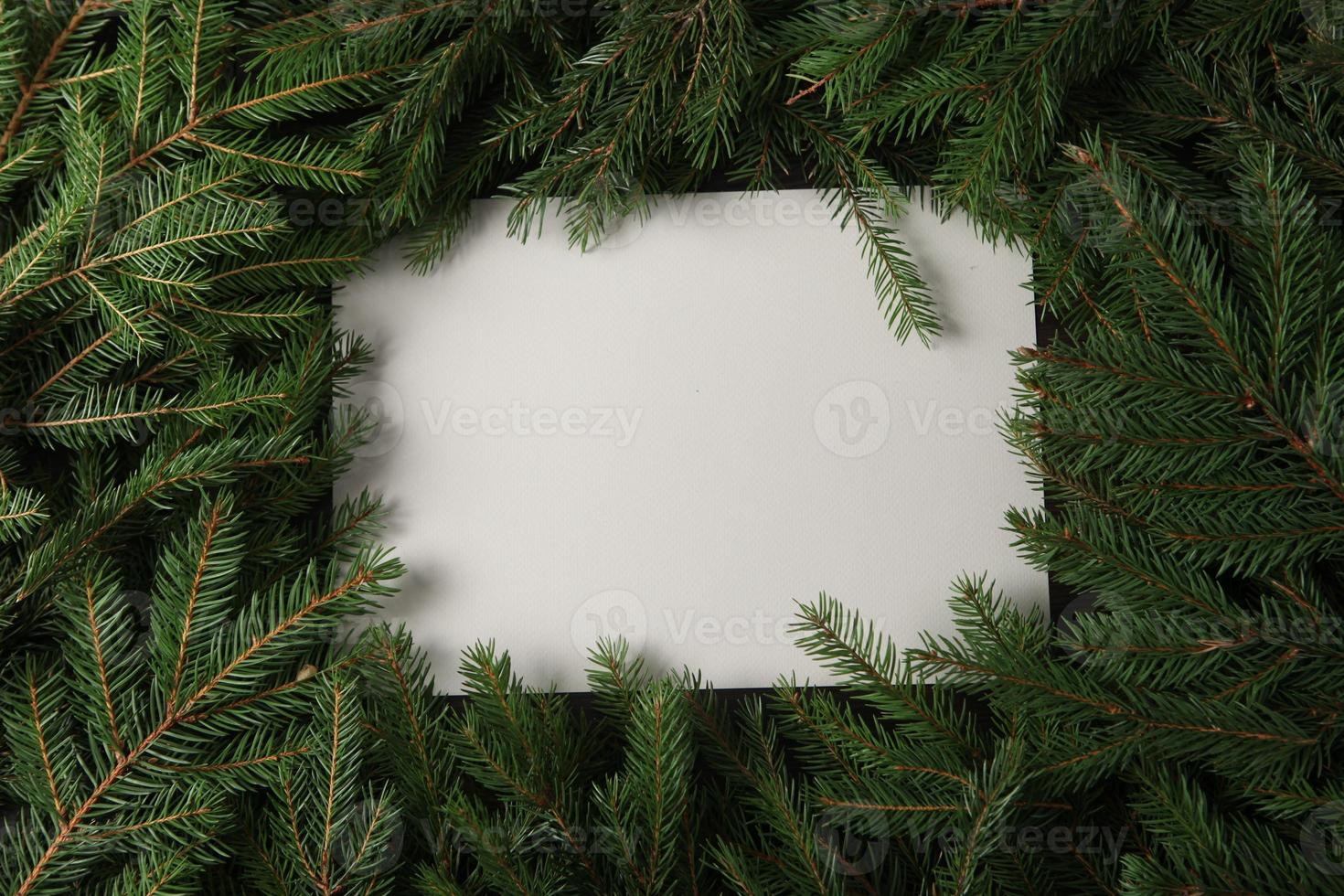 New Year's Eve background with fir branch and cones. Christmas and New Year holidays composition of pine tree branches. photo