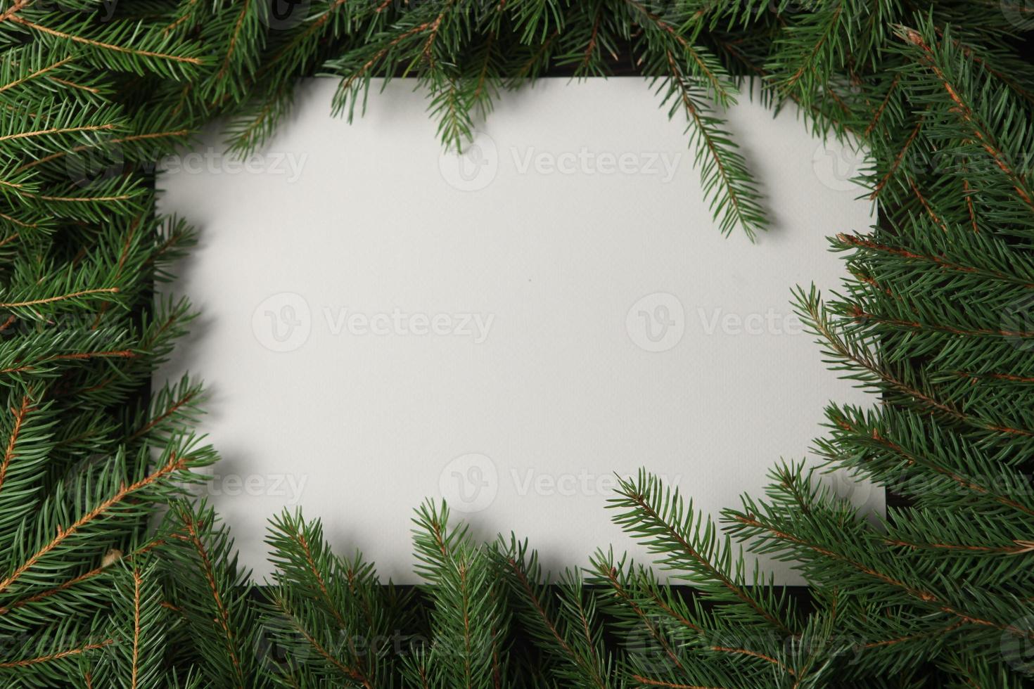 New Year's Eve background with fir branch and cones. Christmas and New Year holidays composition of pine tree branches. photo