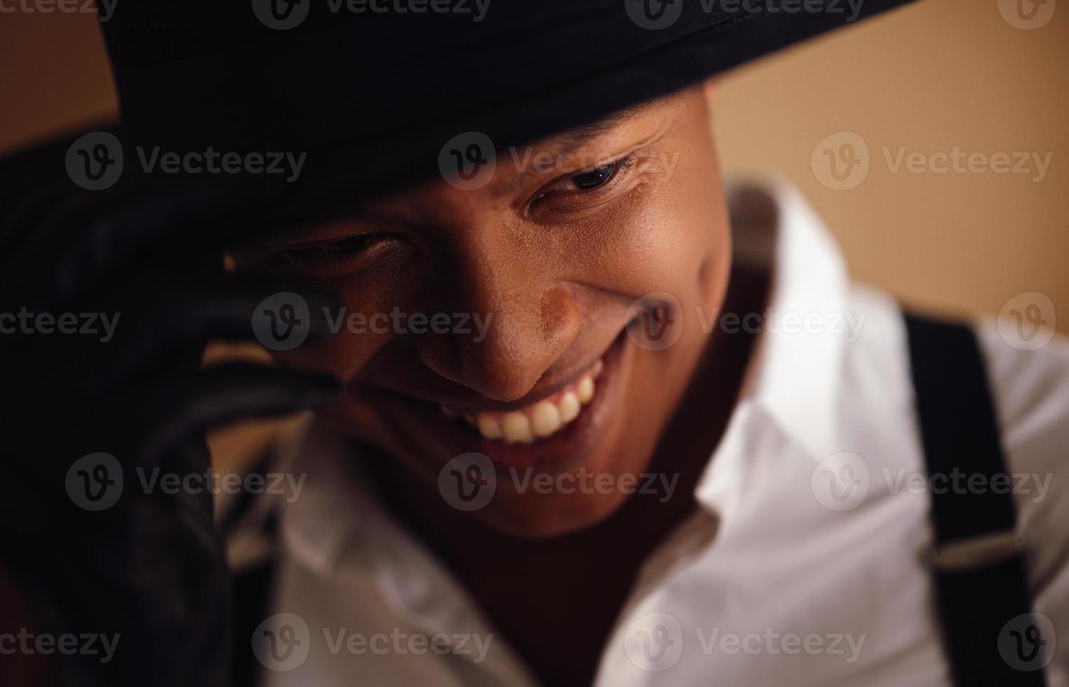 Young man in white shirt smiling photo