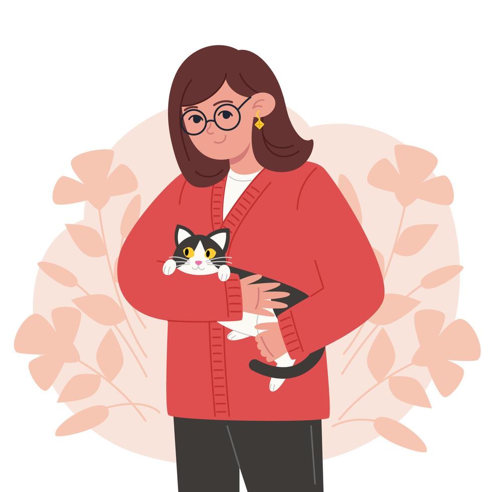 Young woman holding a black and white cat in her arms vector