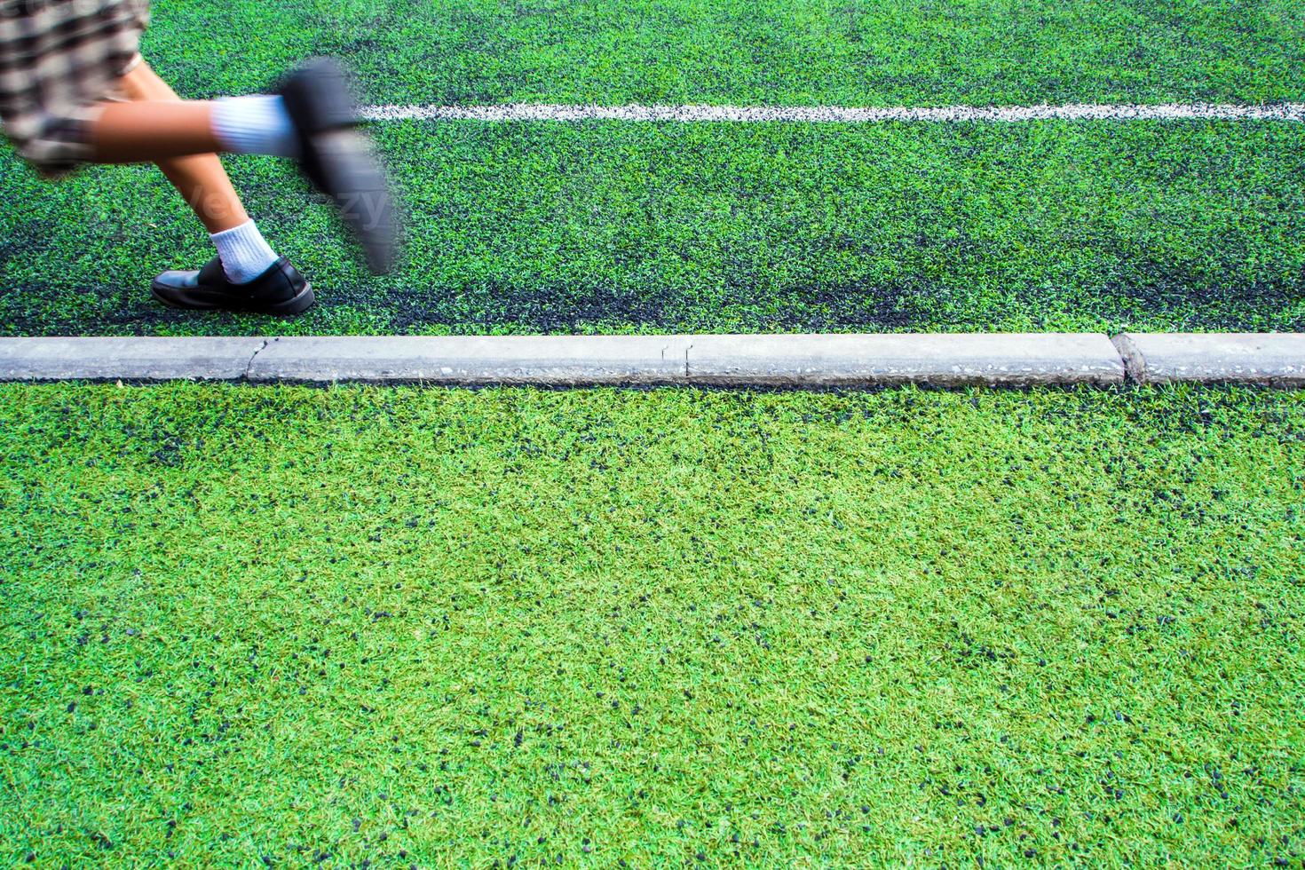 Children in the artificial turf of the school photo