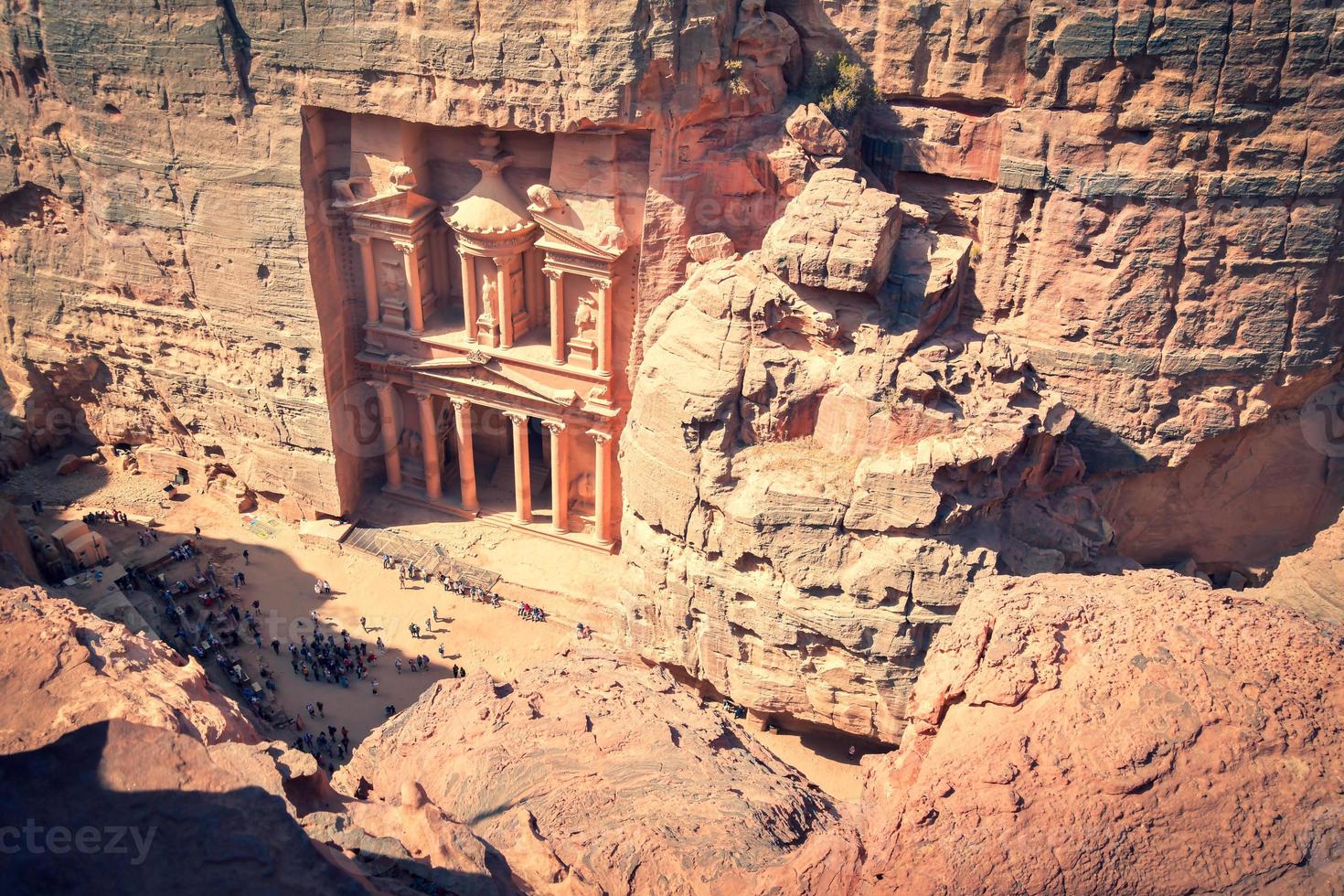 Top view tourist by The temple-mausoleum of Al Khazneh in the ancient city of Petra in Jordan.Cinematic background copy paste photo