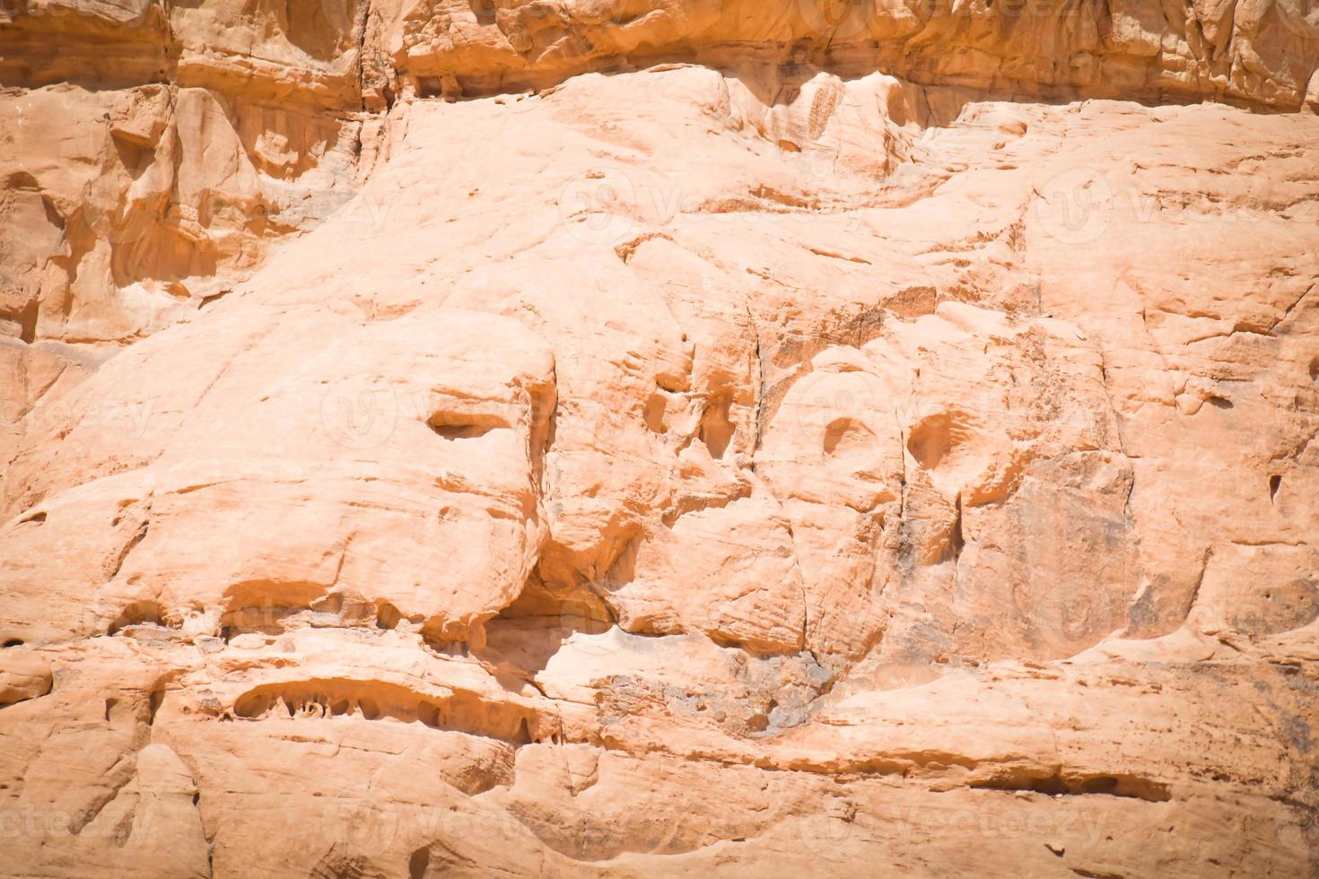 Wadi rum sandstone rock formations with natural symbolic figures on rocks alike star wars characters. Wadi rum desert valley of the moon filming location of famous movies photo