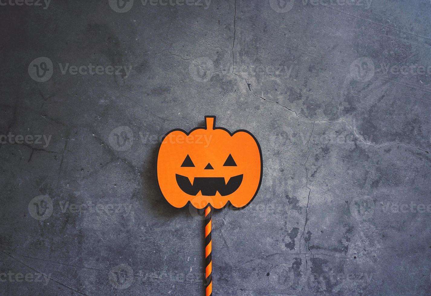 Flat lay of halloween prop for decoration and party on dark stone background with copy space, holiday concept photo