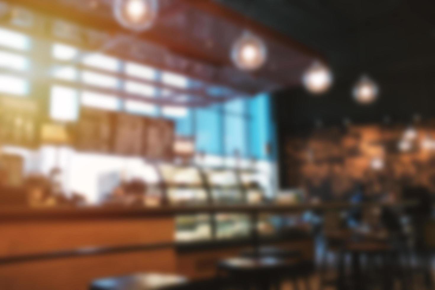 Blur background hipster cafe or restaurant interior with vintage style tone photo