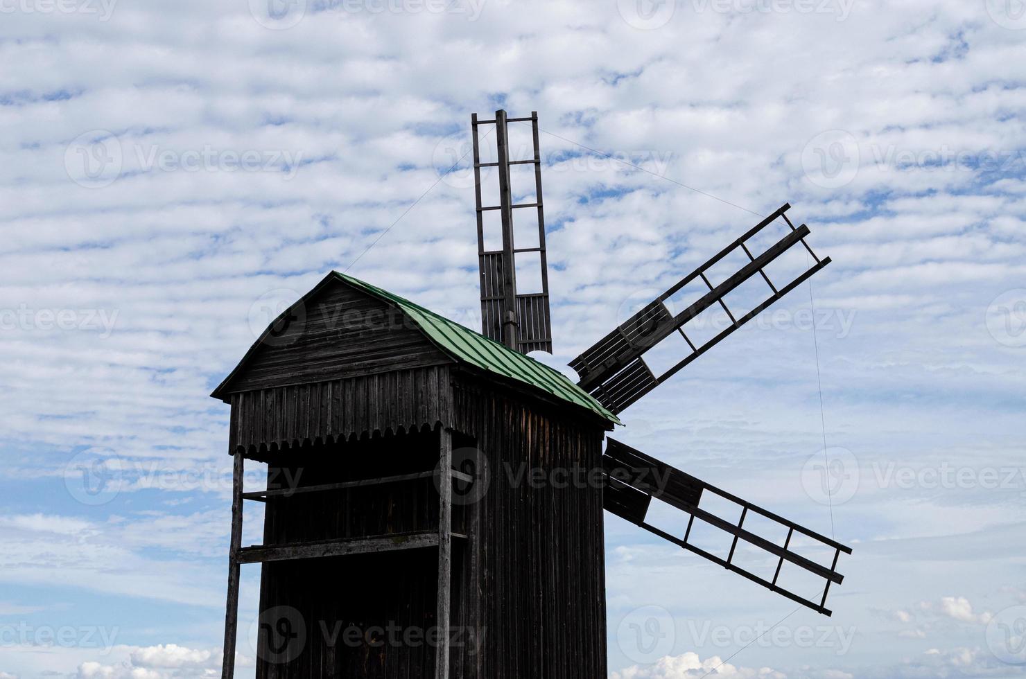 Summer landscape with an old wooden mill photo