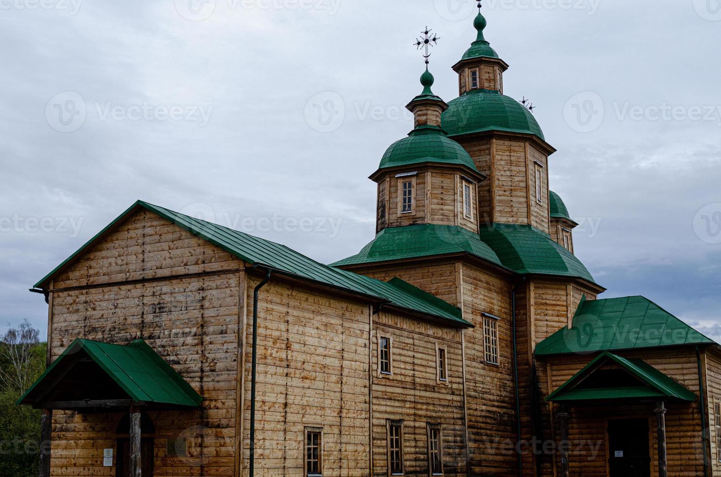 Ancient wooden church  in Ukraine Cross photo