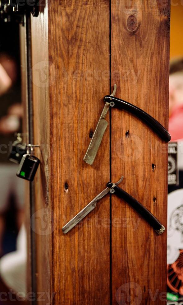 Straight razor in frame in barbershop photo