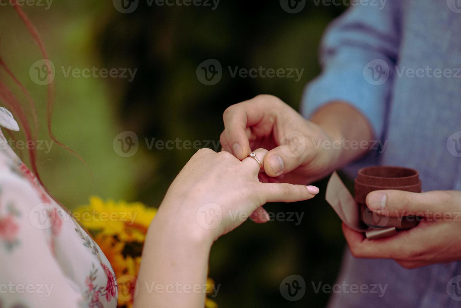 Bride and groom exchange rings at the wedding. photo