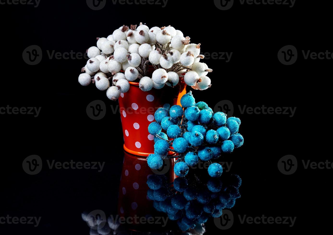 aluminum ice bucket laid in wait for use. stainless multi-colored bucket with white green blue berries in ice photo
