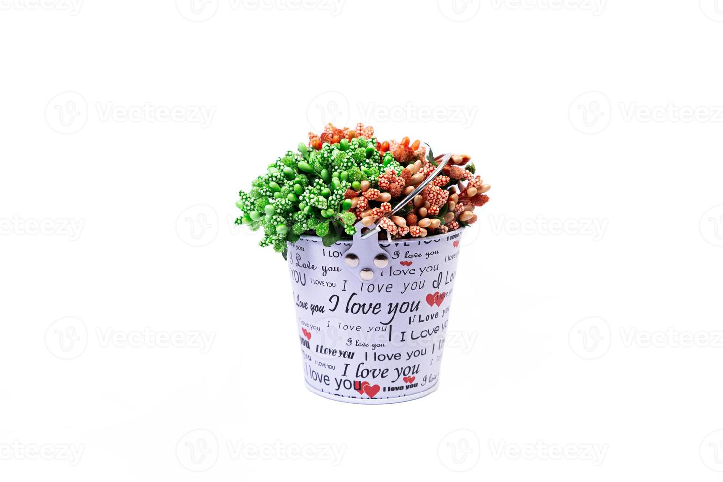 aluminum ice bucket laid in wait for use. stainless multi-colored bucket with green blue flowers photo