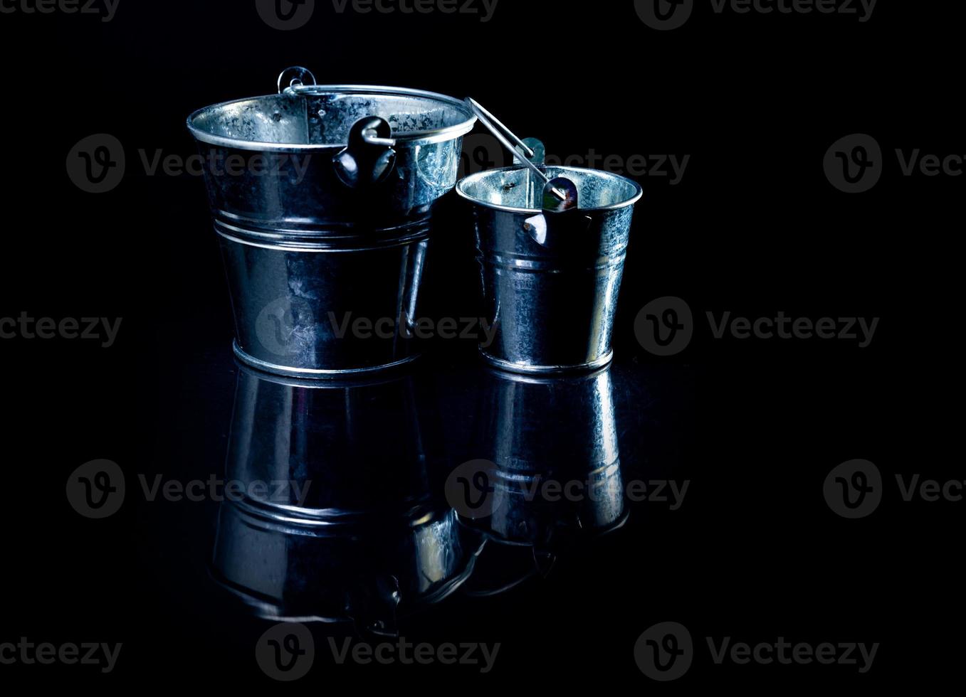 Many aluminum ice bucket laid in wait for use. many stainless multi-colored buckets photo