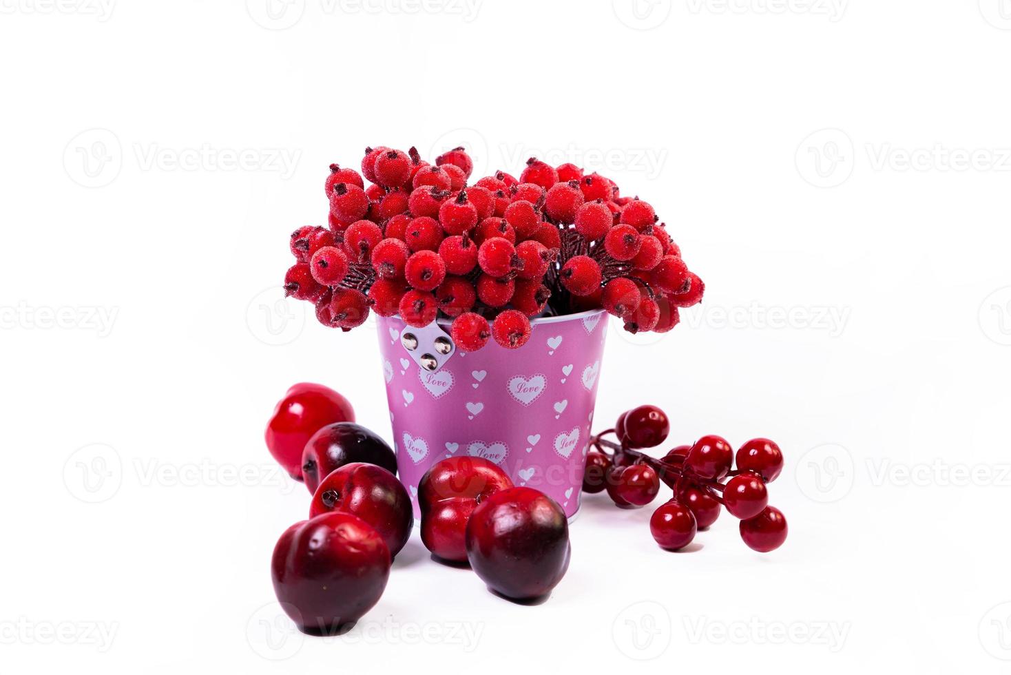 aluminum ice bucket laid in wait for use. stainless multi-colored bucket with red apples with white green blue berries in ice photo