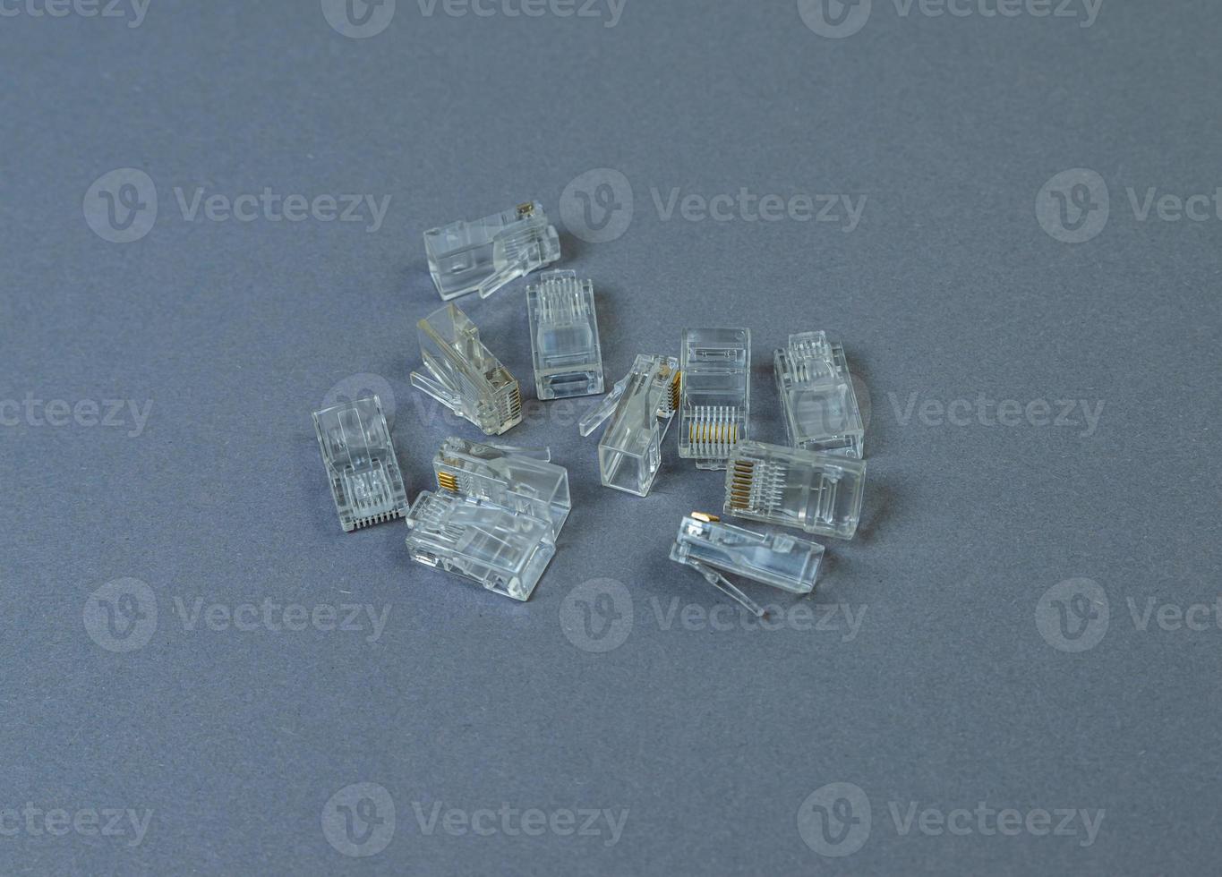 Connector rj-45 close-up on grey background isolate photo