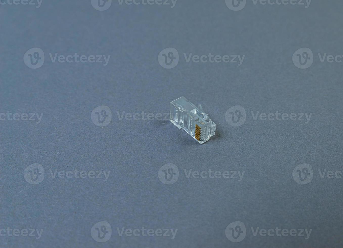 Connector rj-45 close-up on grey background isolate photo