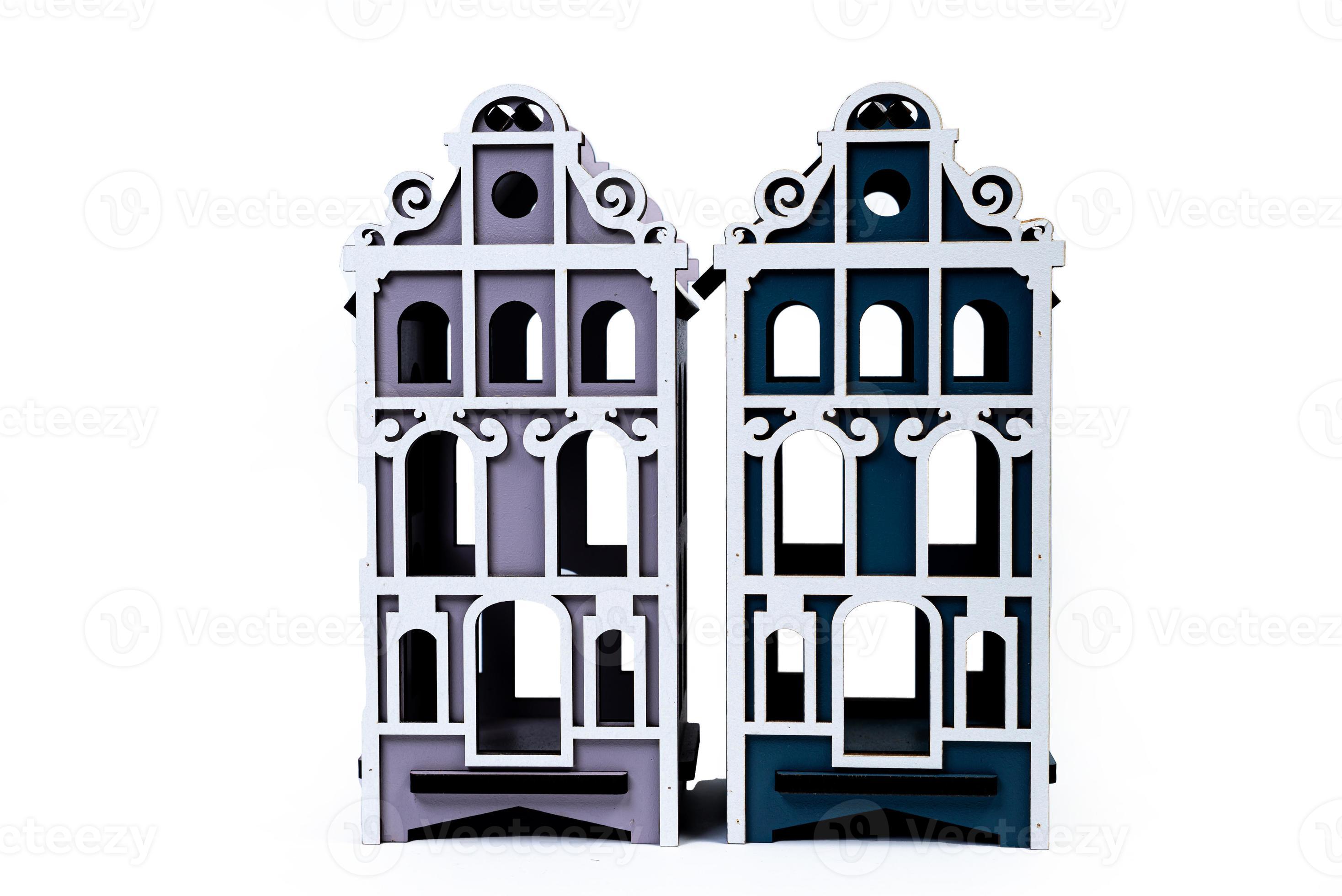 Houses symbol with metal key on white background. Real estate